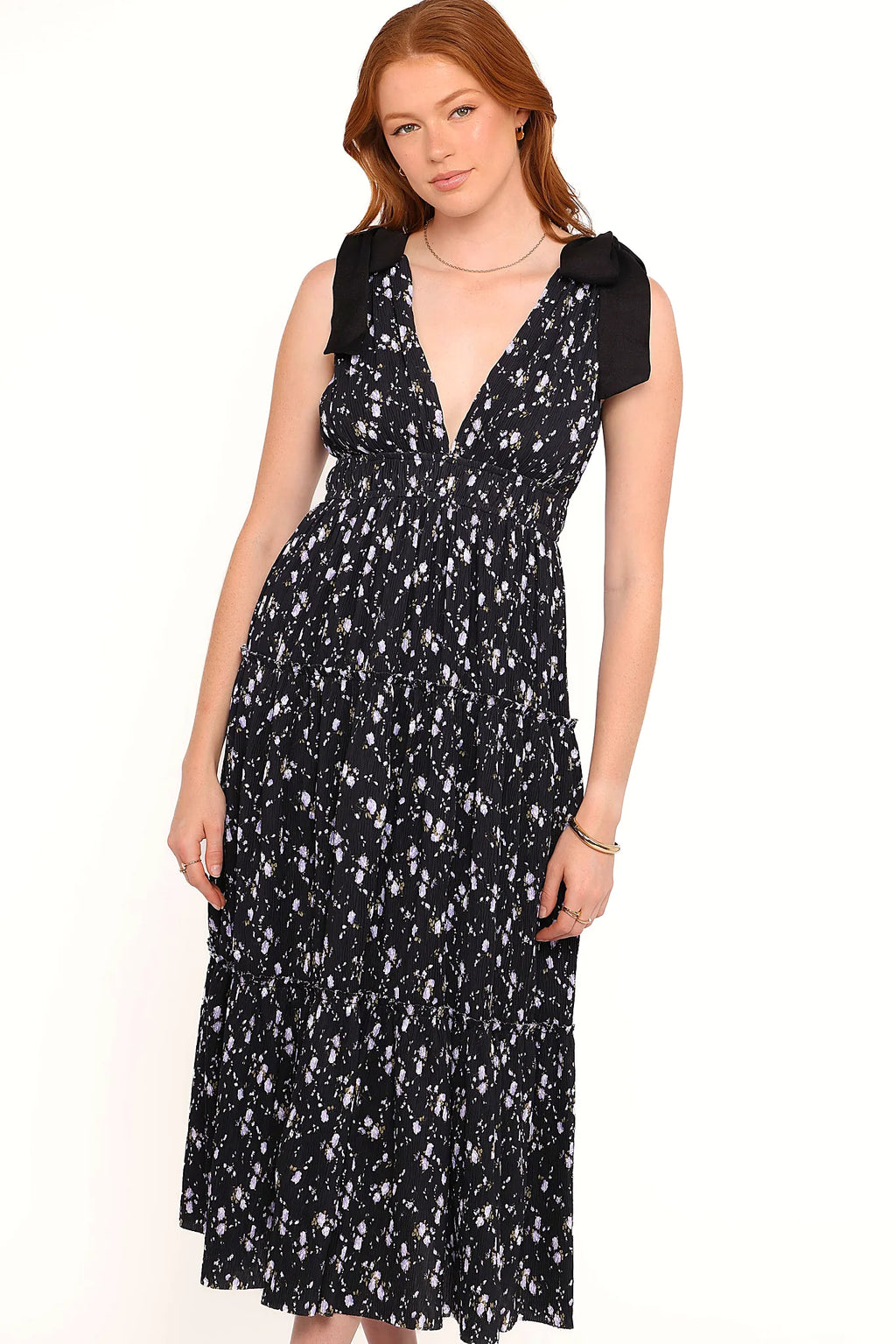 Wide non adjustable straps with shoulder ties on a black floral maxi dress