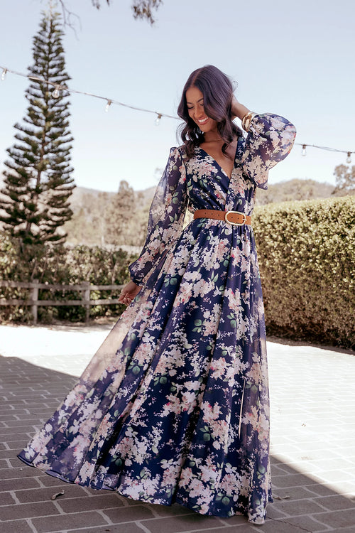 Long sheer sleeves and a-line skirt on a navy floral maxi dress