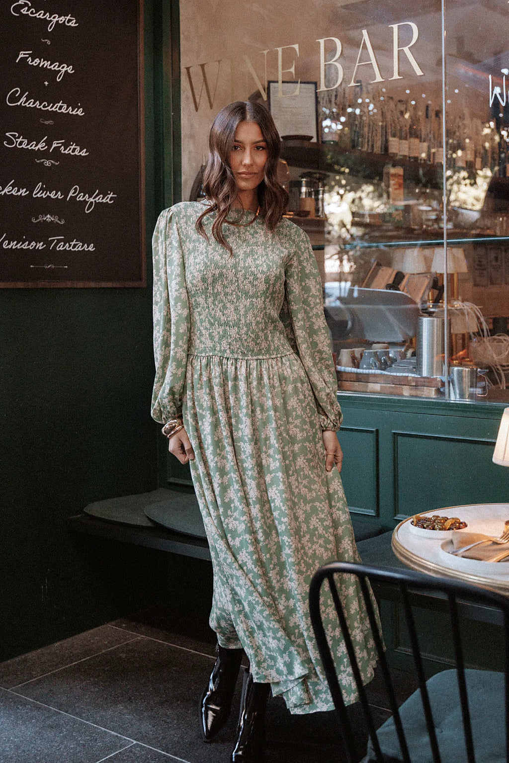 Shirred bodice and a-line skirt on a green floral midi dress