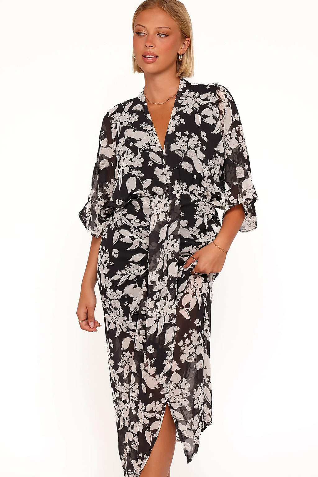 Open back detail with button close on a black floral maxi dress