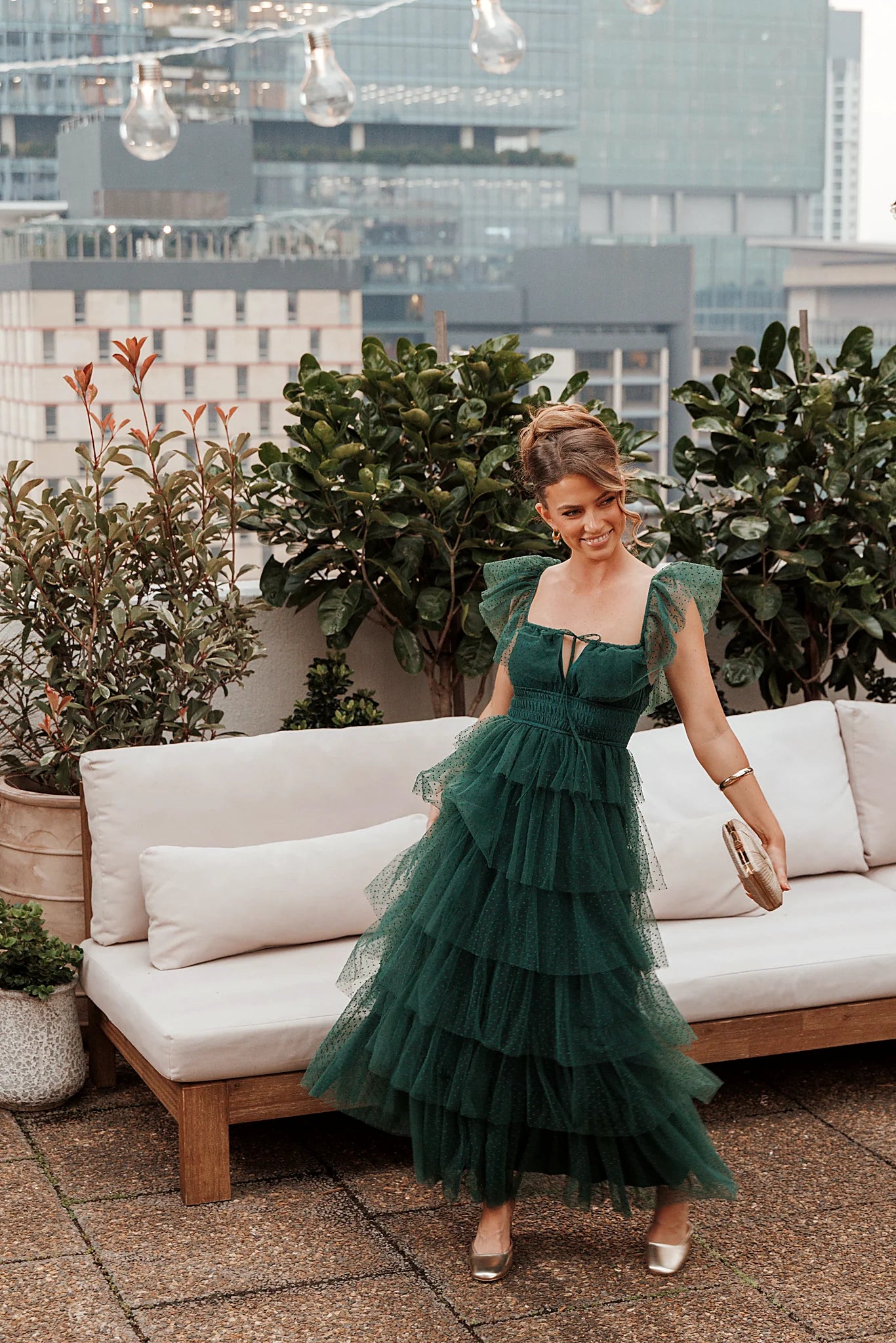 Tiered ruffle tulle skirt on a green maxi dress with shirred waistband