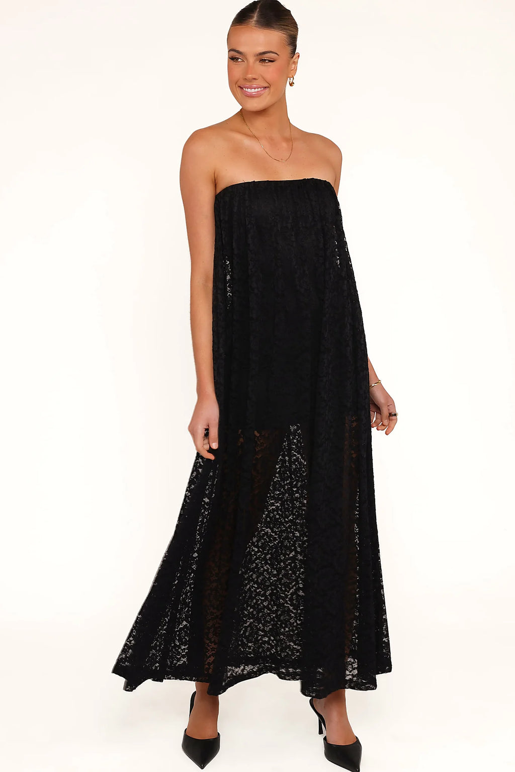 Elasticised straight neckline on a black lace maxi dress
