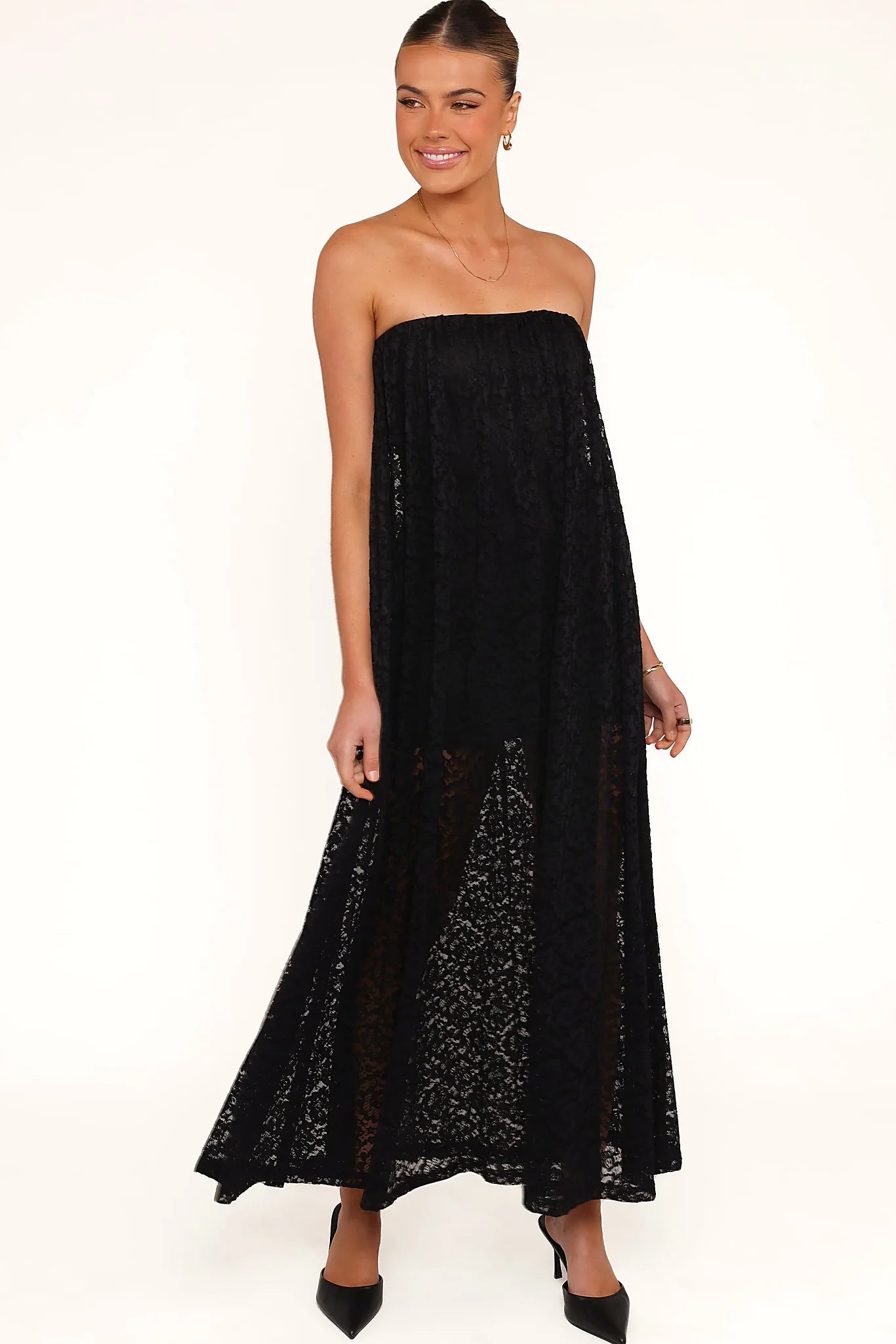 Elasticised straight neckline on a black lace maxi dress