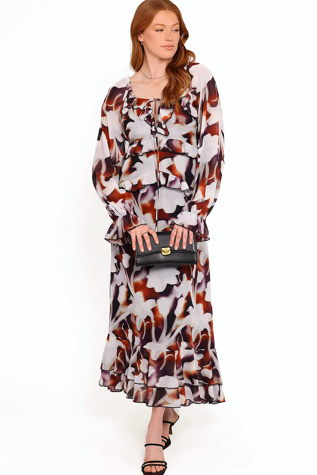 Bust cutout with tie close and belt loops on a floral maxi dress