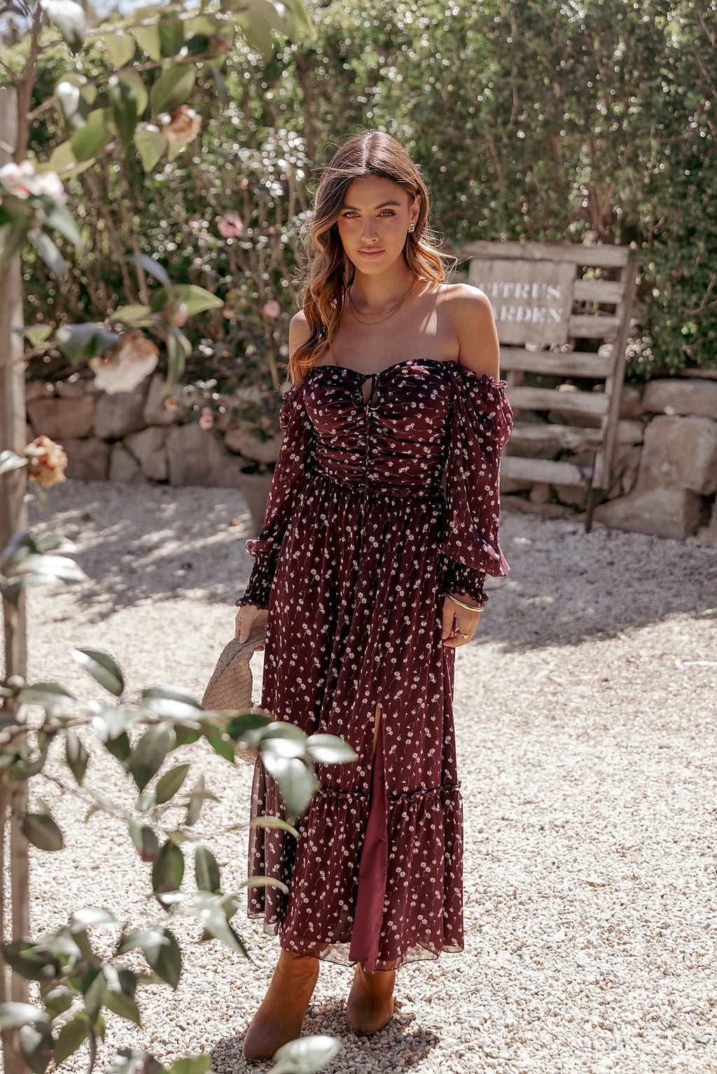 Ruched bodice with front cutout and tie close on a floral maxi dress