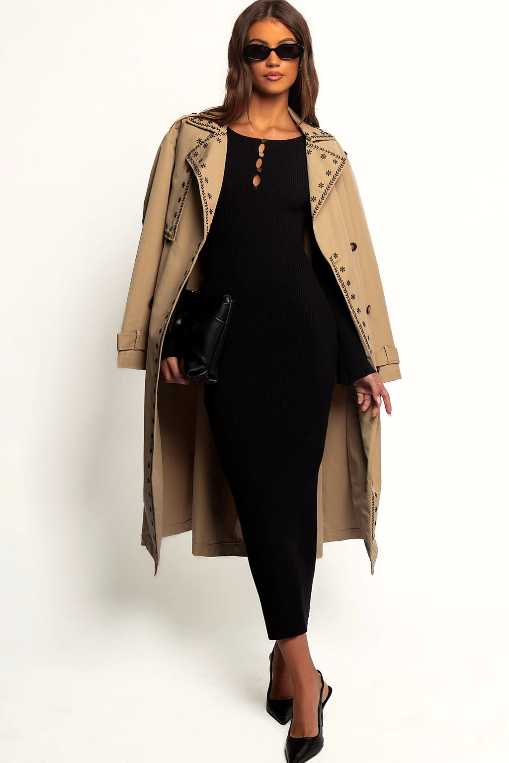Gold decorative buttons on a black bodycon knit maxi dress