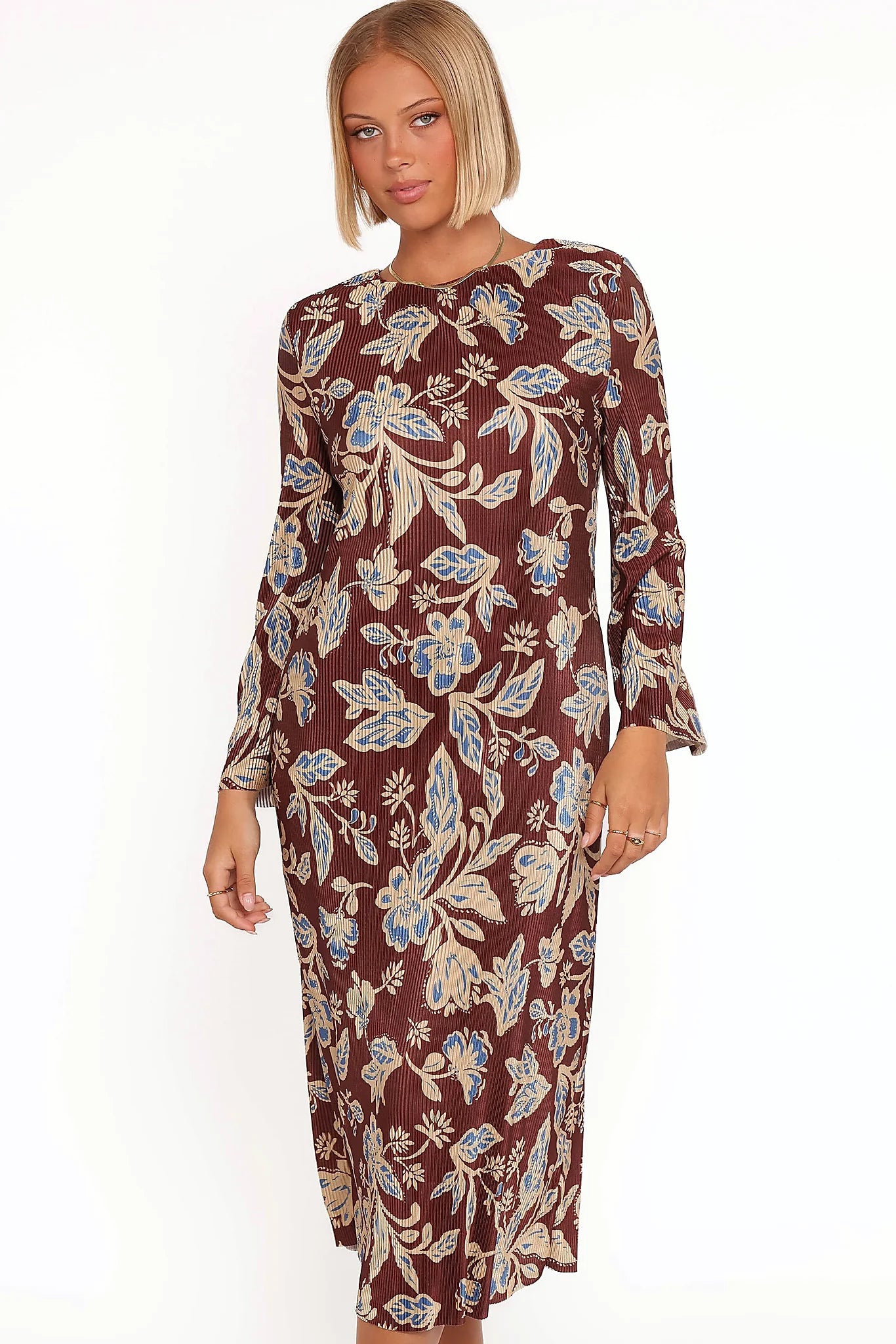 Long flare sleeves on a brown floral satin midi dress