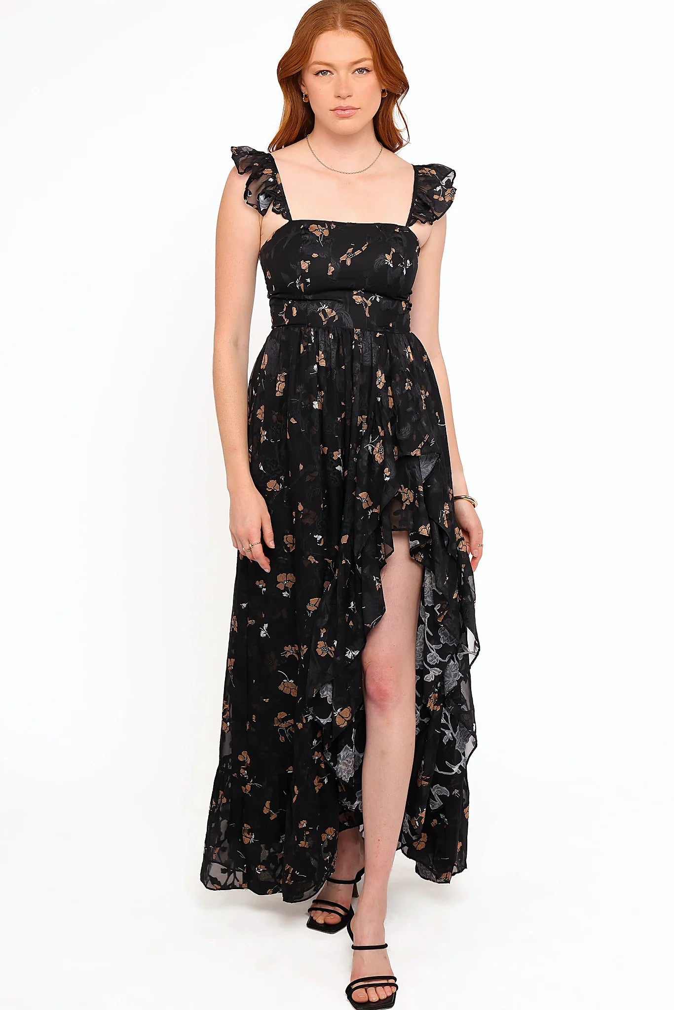 Front split and thin adjustable straps on a floral maxi dress