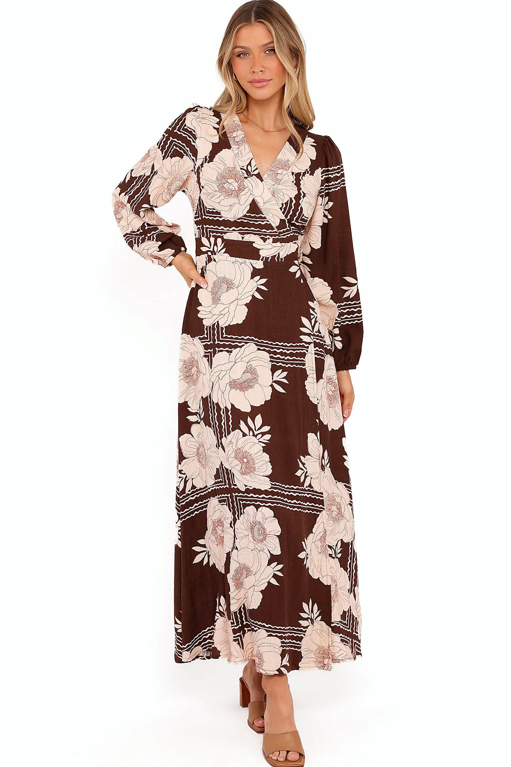 Attached waist ties and functional pockets on a brown floral wrap dress